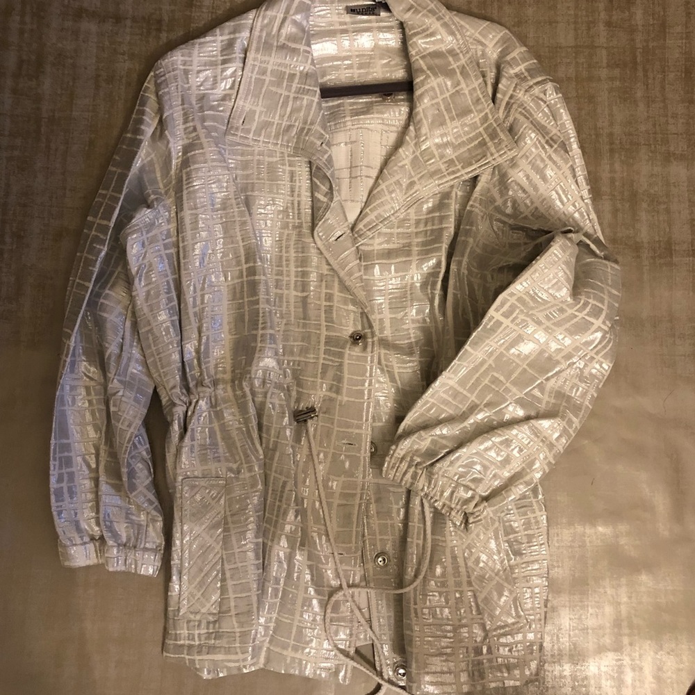 white & silver jacket.